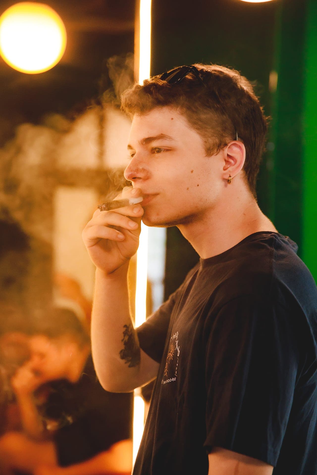 Portrait at a neon-lit lounge